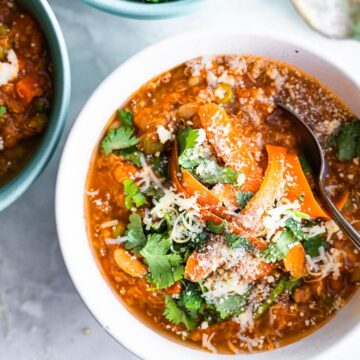 Overhead view bowls filled with Instant Pot Sausage and Quinoa Stew