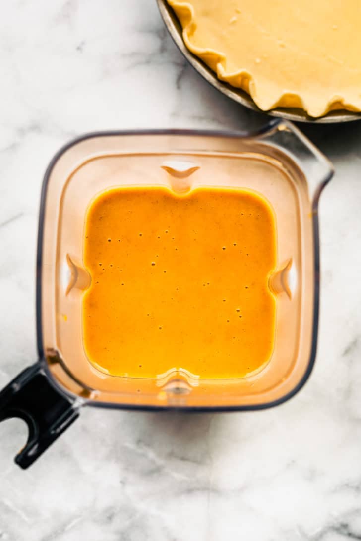 pumpkin pie puree filling in blender cup.