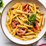 bowl of gluten free penne with creamy dairy free tomato sauce