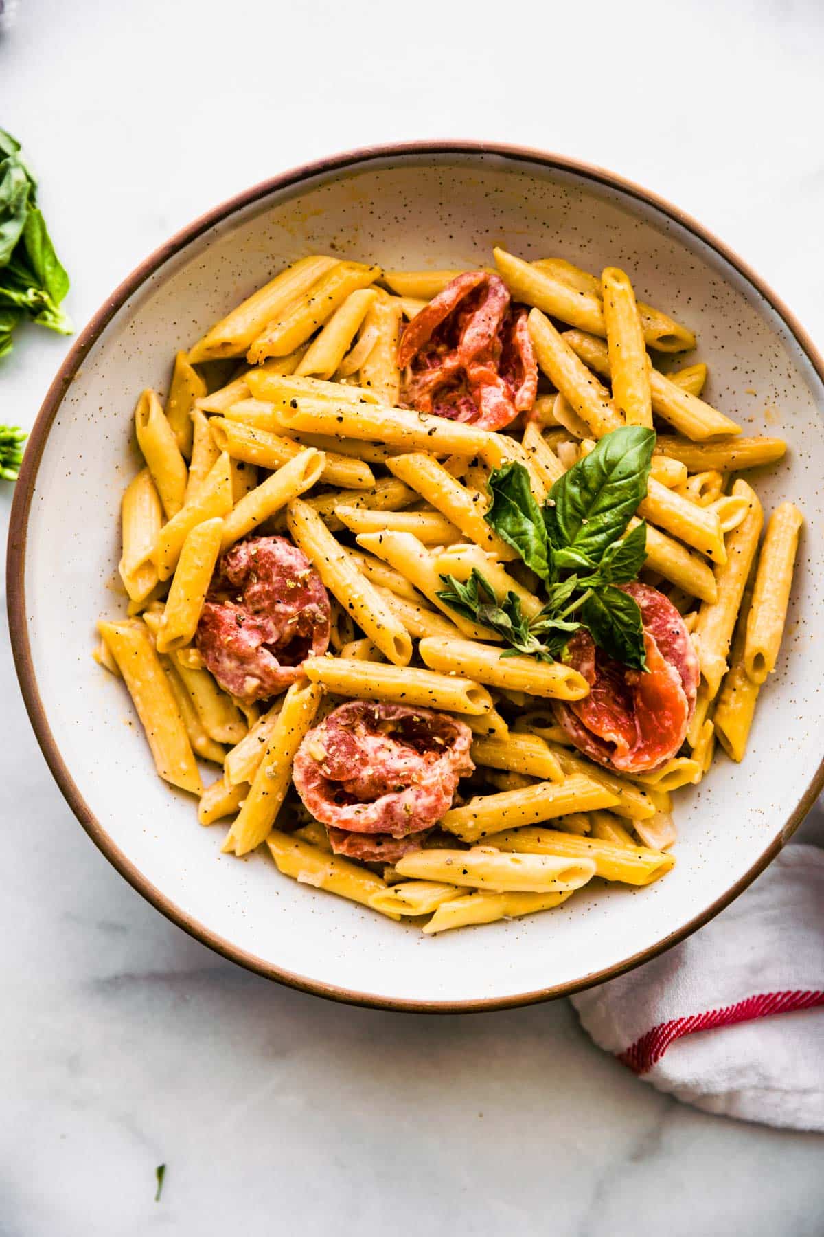 bowl of gluten free penne with creamy dairy free tomato sauce