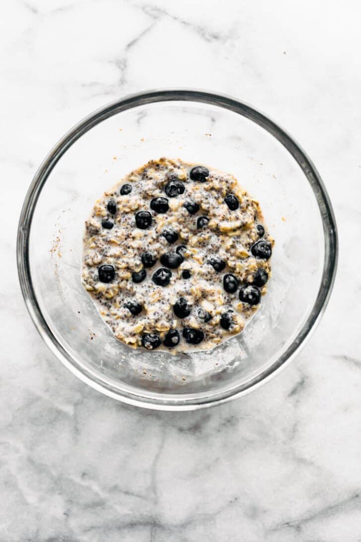 prep bowl of overnight oatmeal with blueberries