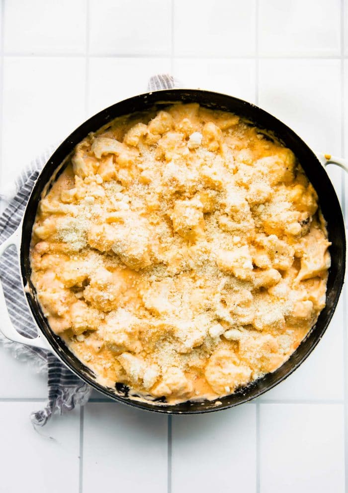 overhead: casserole dish of gluten free cheesy cauliflower casserole, not baked
