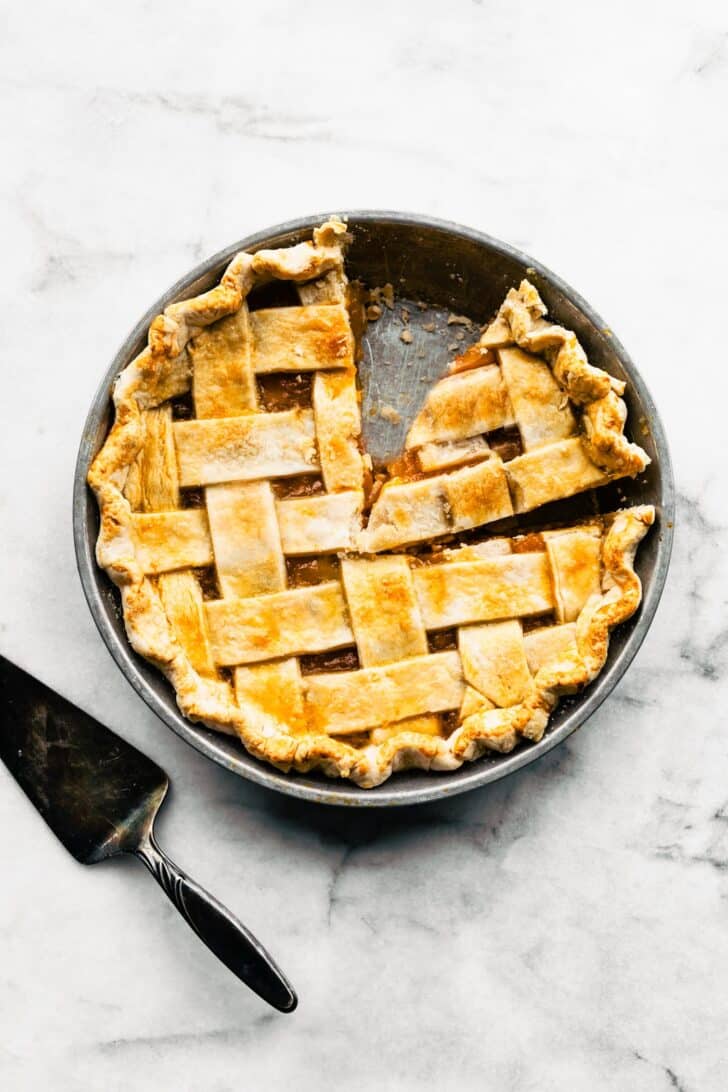 Apricot pie with a slice cut in the pan