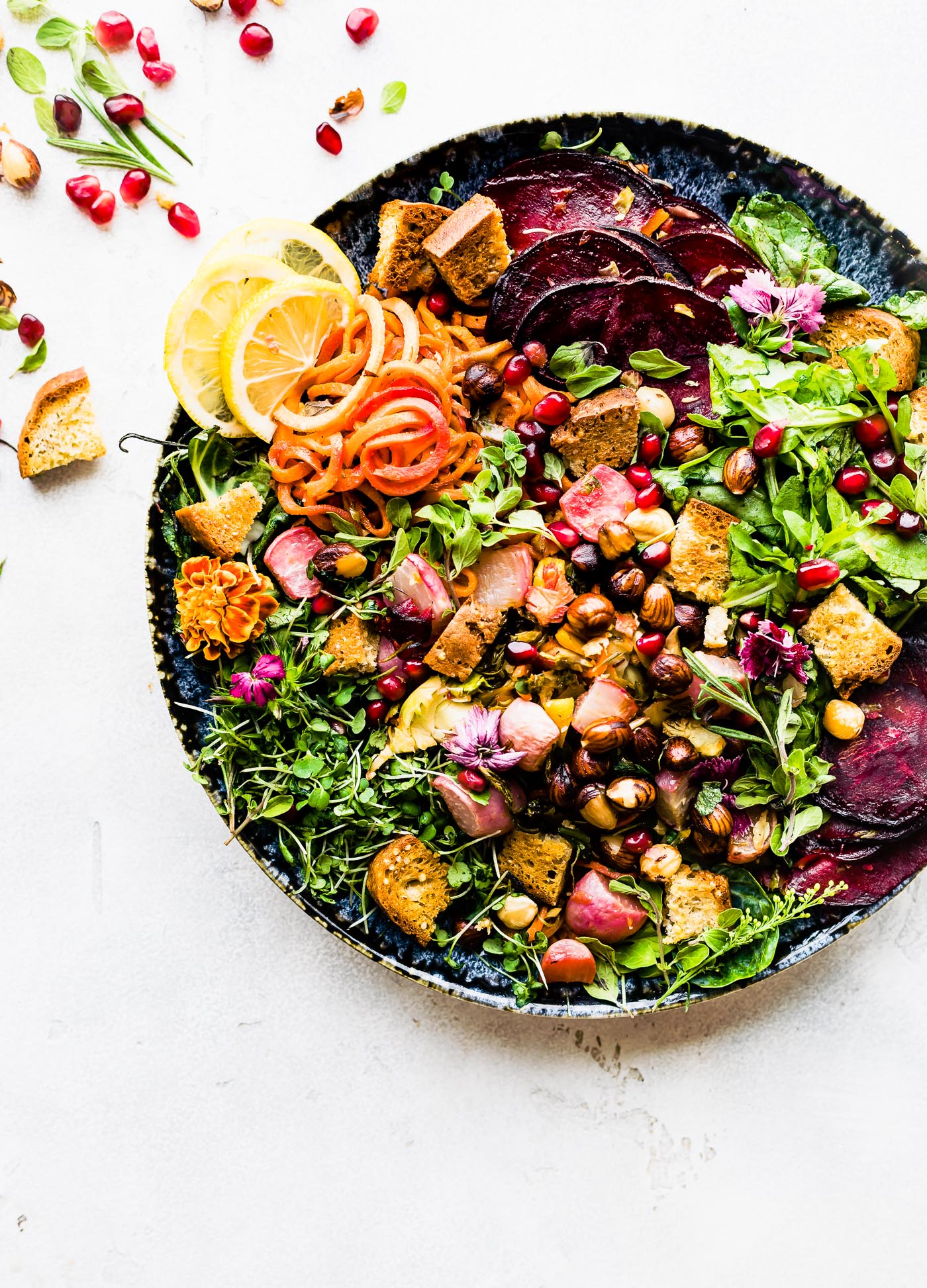 panzanella salad with fall vegetables served on stone bowl.