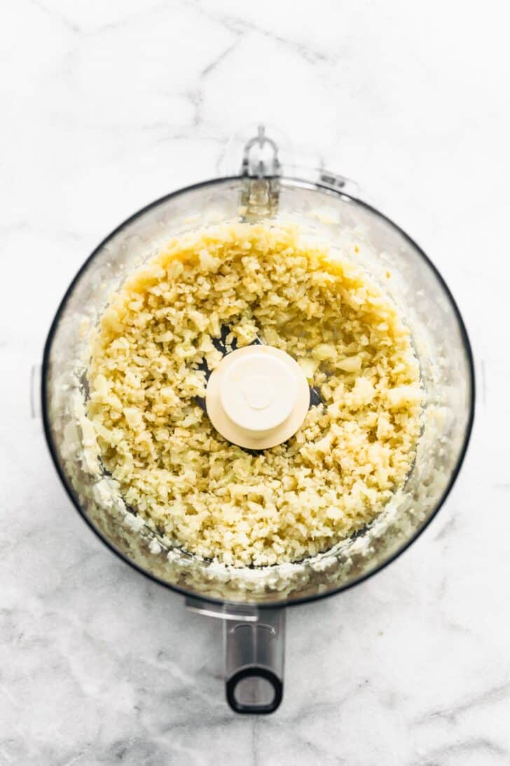 Cauliflower riced in a food processor.