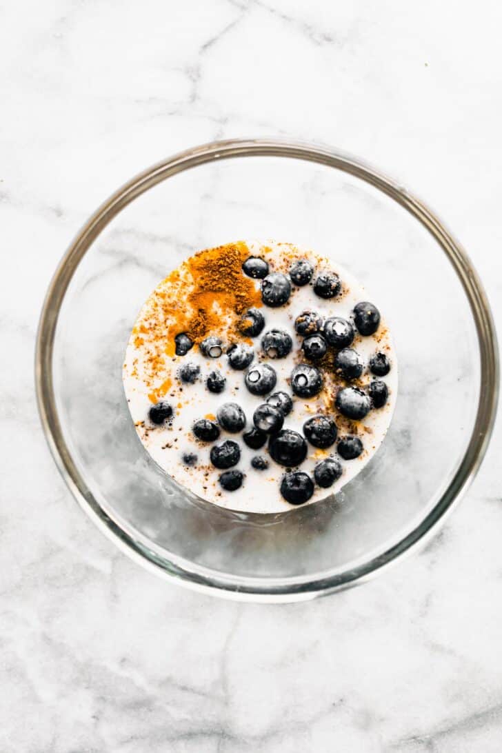 bowl of overnight oats ingredients soaking in milk.