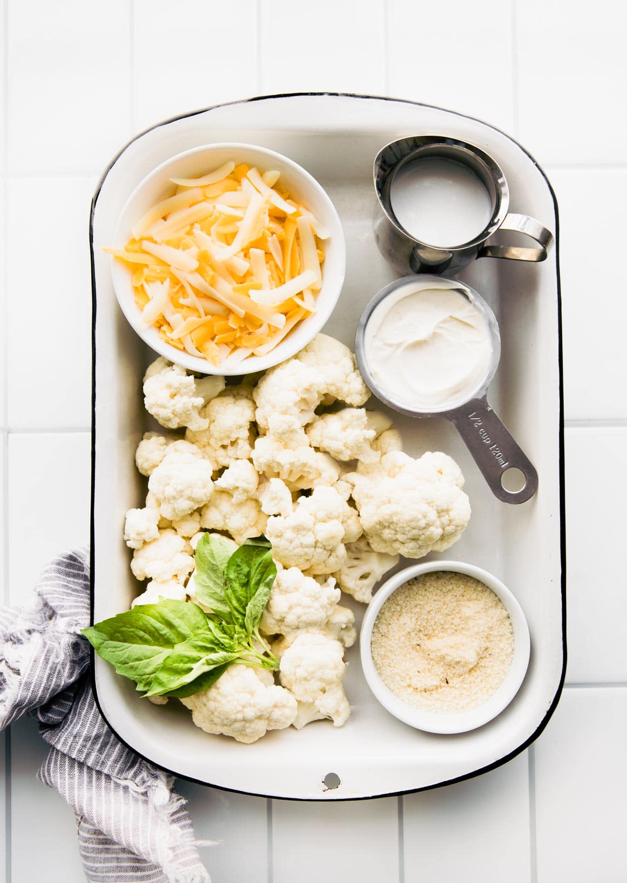 ingredients on a tray to make cauliflower mac and cheese recipe