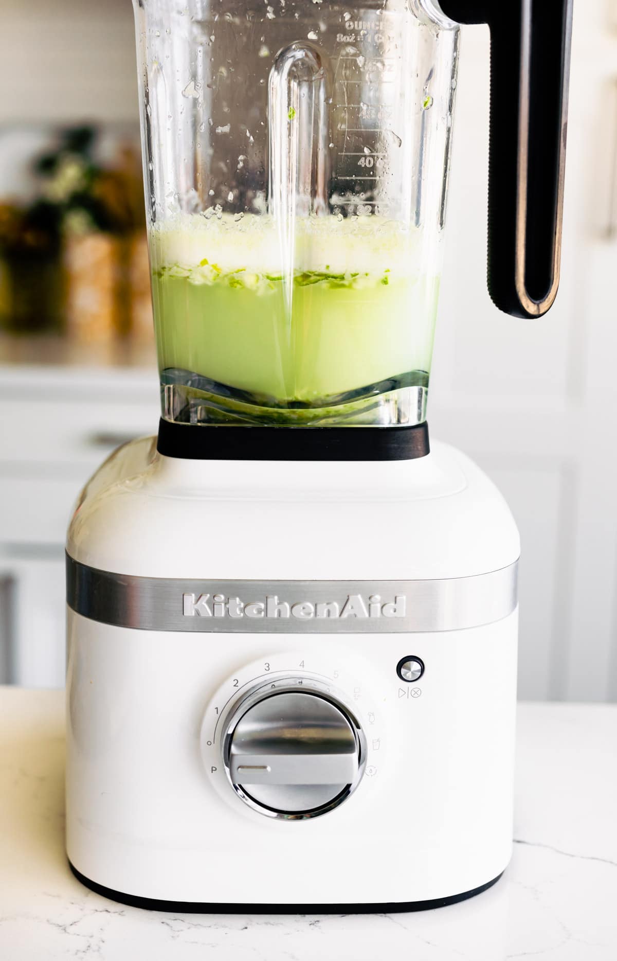 Ingredients mixing in blender to make a Brazilian lemonade recipe.