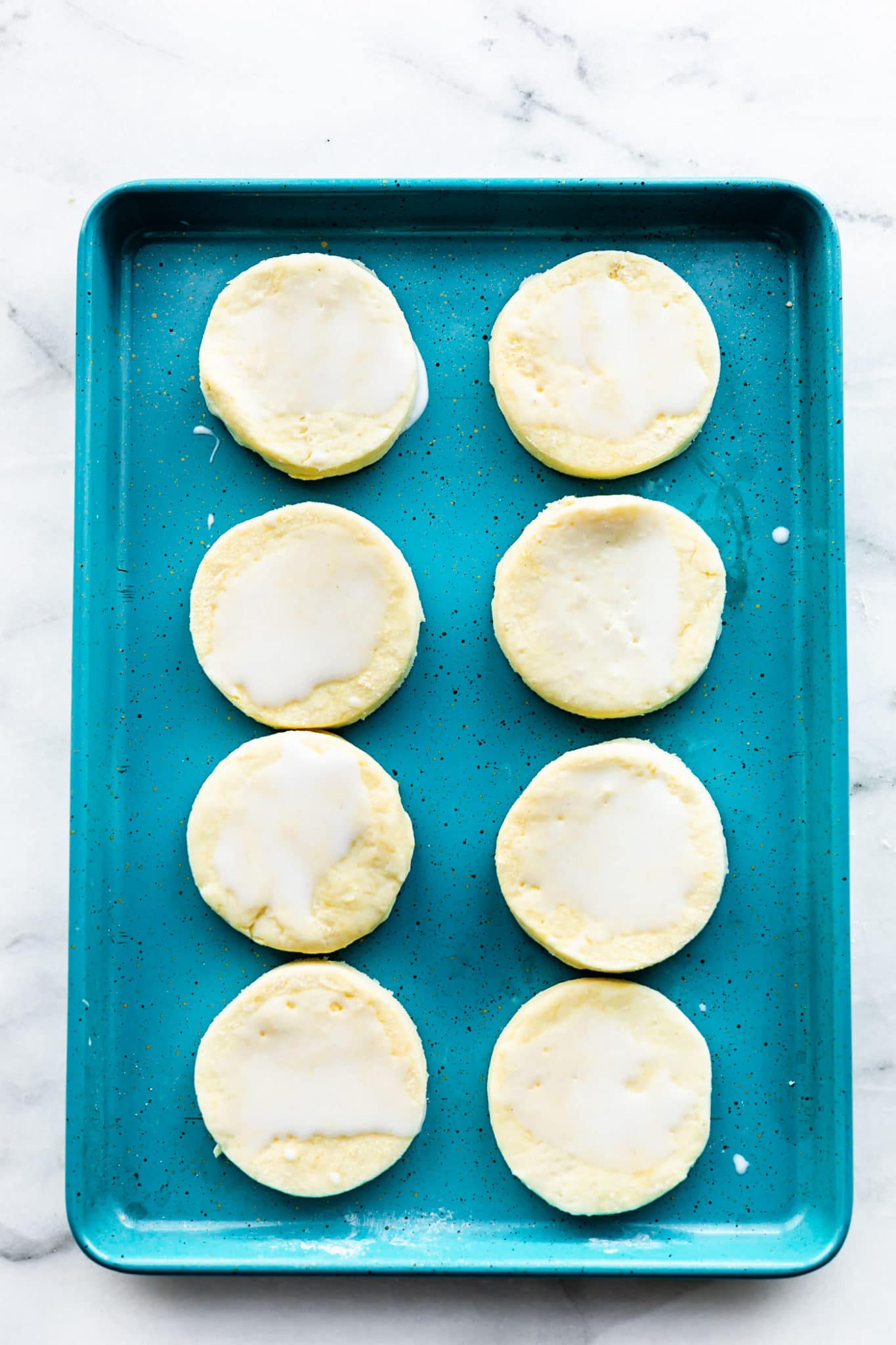raw gluten free biscuits on a baking sheet
