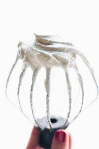 coconut cream vegan frosting on stand mixer whip attachment