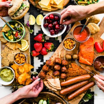 Overhead image of BBQ Graze Board with summer picnic and BBQ dishes