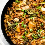 Overhead photo of gluten free teriyaki chicken casserole in a black oven safe pan.