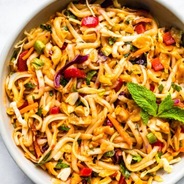 Overhead photo of a cold gluten free Thai noodle salad in a white bowl.