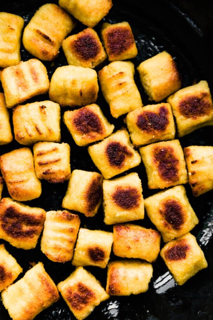 Homemade gnocchi pan fried in a skillet.