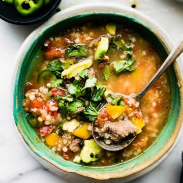 overhead image of loaded fajita steak soup being picked up with a spoon