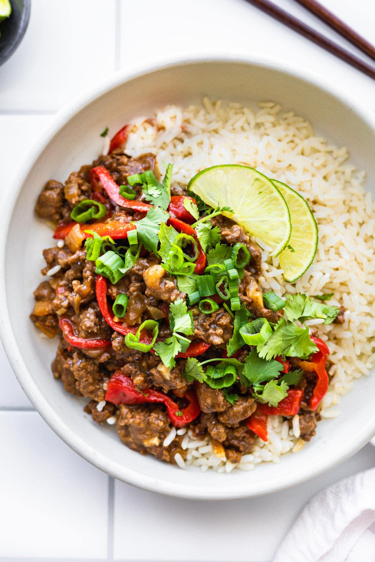 Gluten free Asian beef bulgogi dinner with white rice on a white plate.