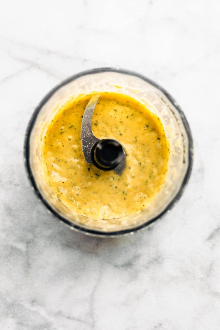 Lemon sage sauce in a food processor bowl.