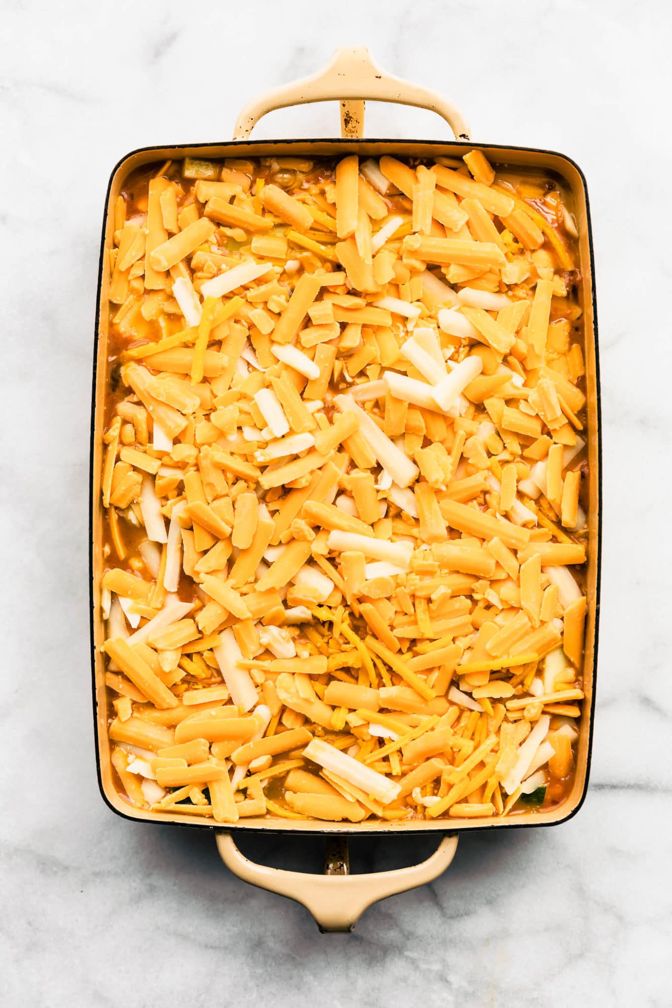 overhead image of unbaked tex-mex egg and cauliflower casserole in a casserole dish