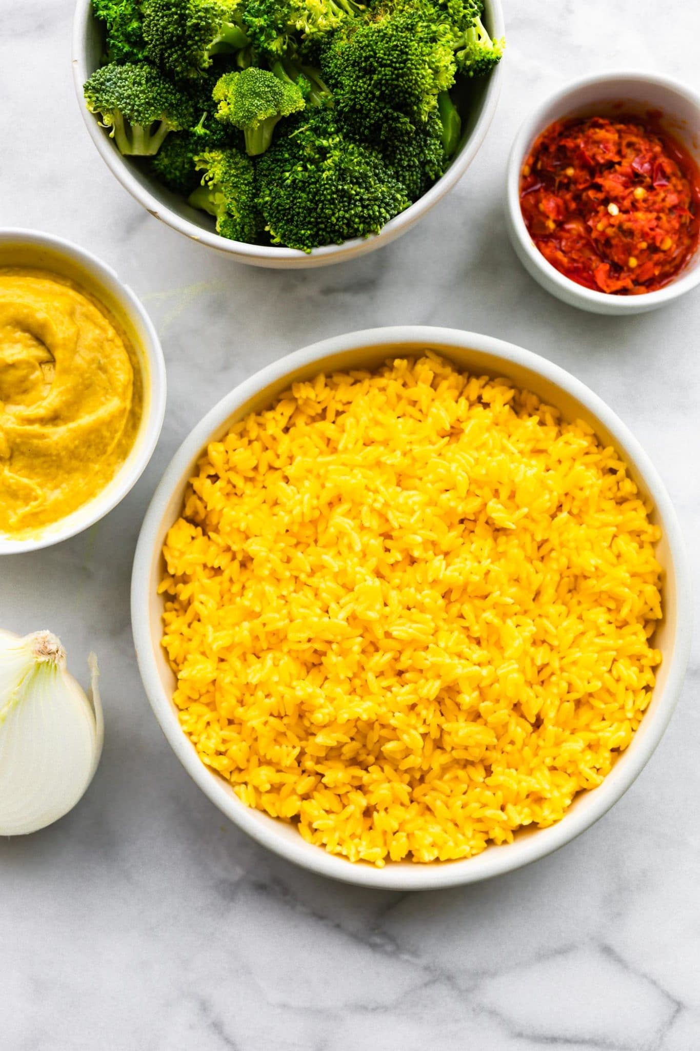 broccoli, spicy hummus, cooked orzo, onion, and vegan cheese sauce for broccoli cheese casserole