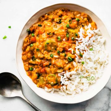 Overhead view white bowl filled with Instant Pot Gumbo served with white rice.