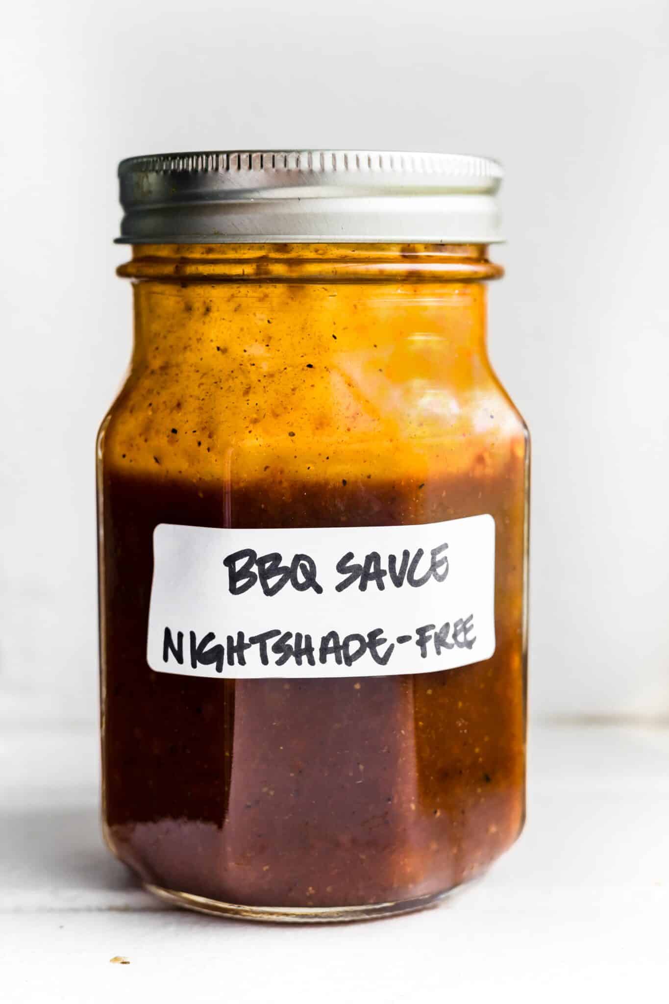 Nightshade free BBQ sauce in a jar with a label and lid.