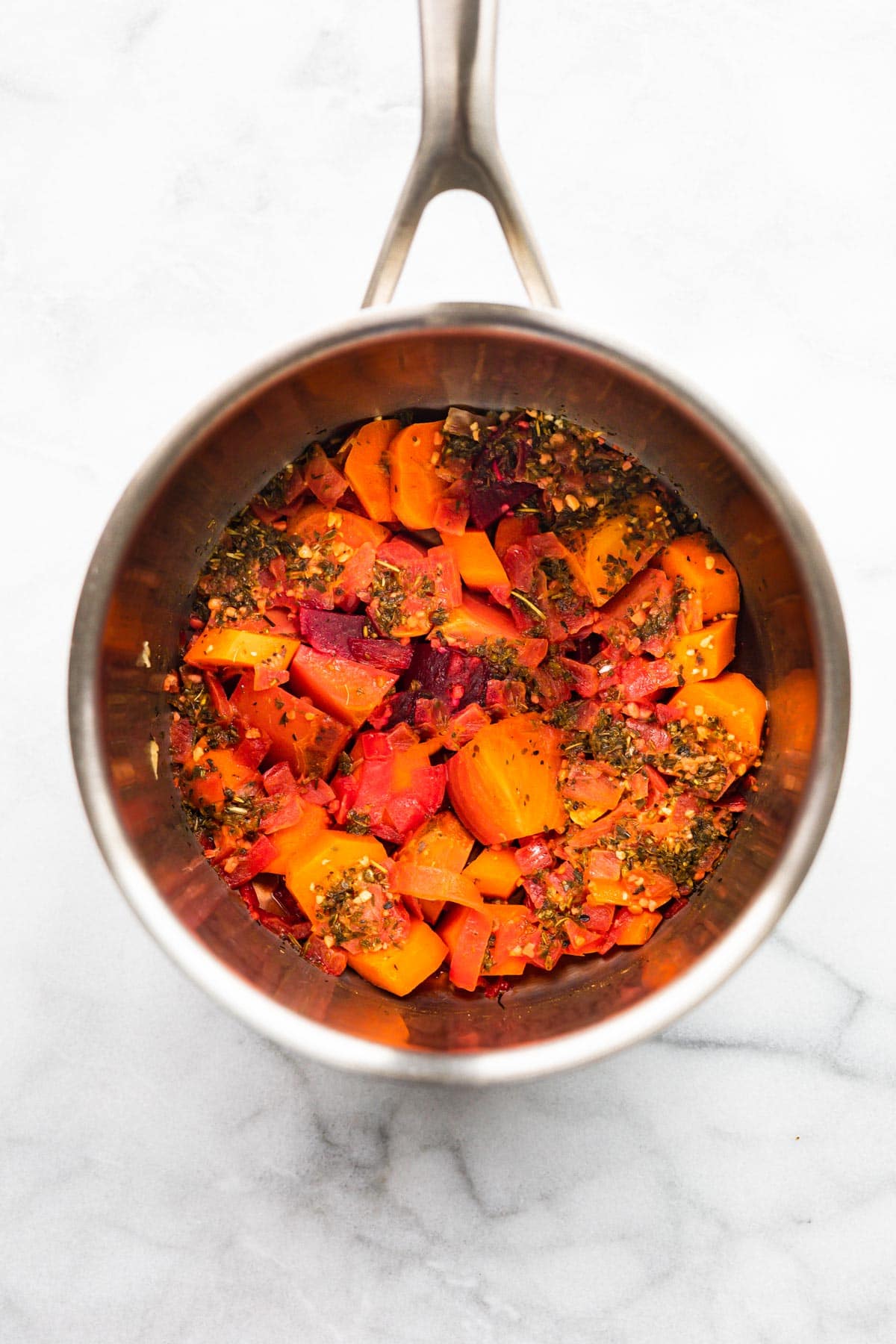 Beets and carrots cooking in a pot for a tomato free pasta sauce.