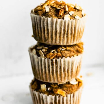 3 gluten free applesauce muffins stacked on top of each other