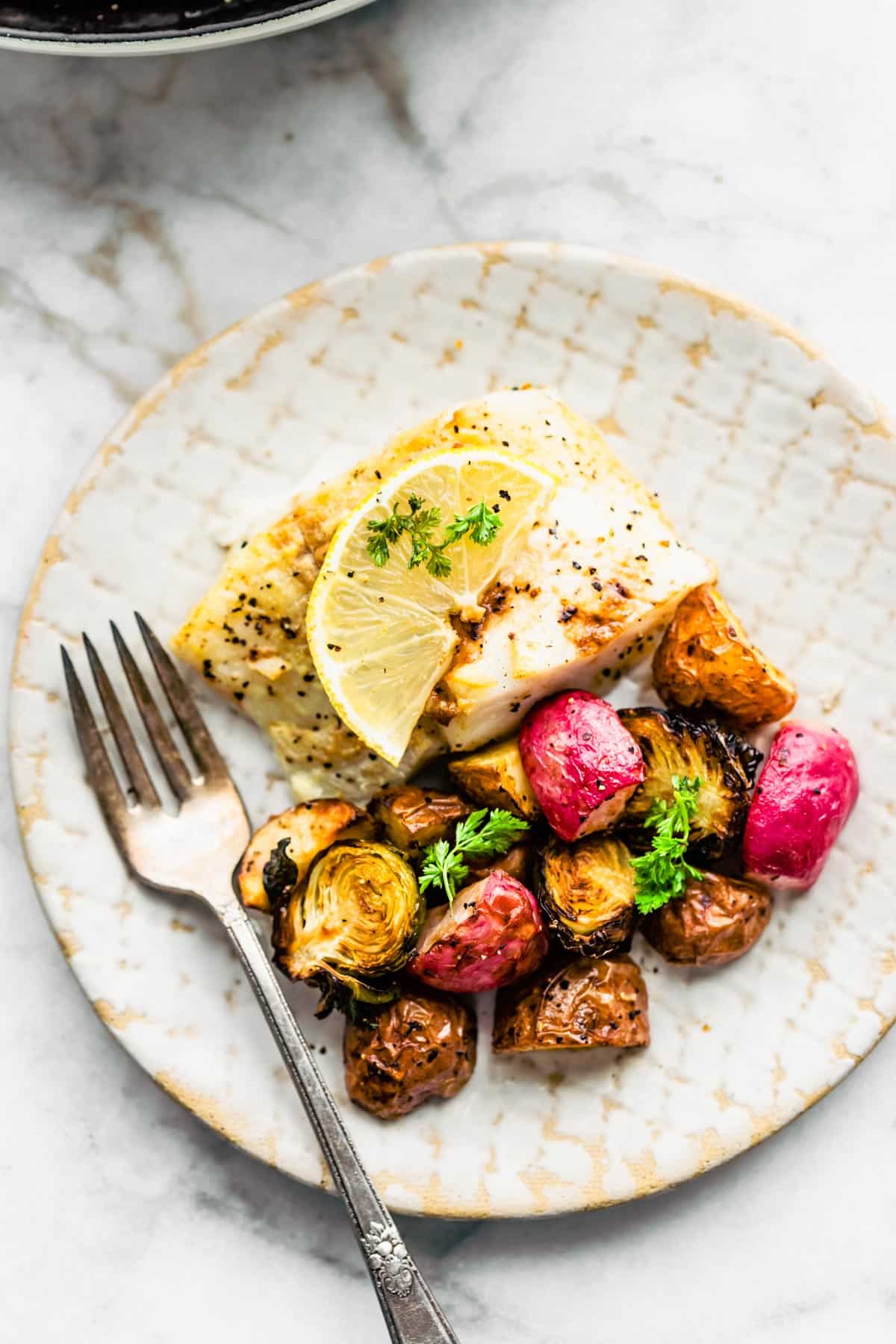 Easy Baked Fish and Vegetables on a plate.