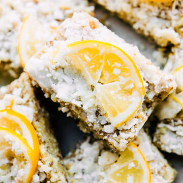 plate of no-bake lemon coconut bars cut into rectangles