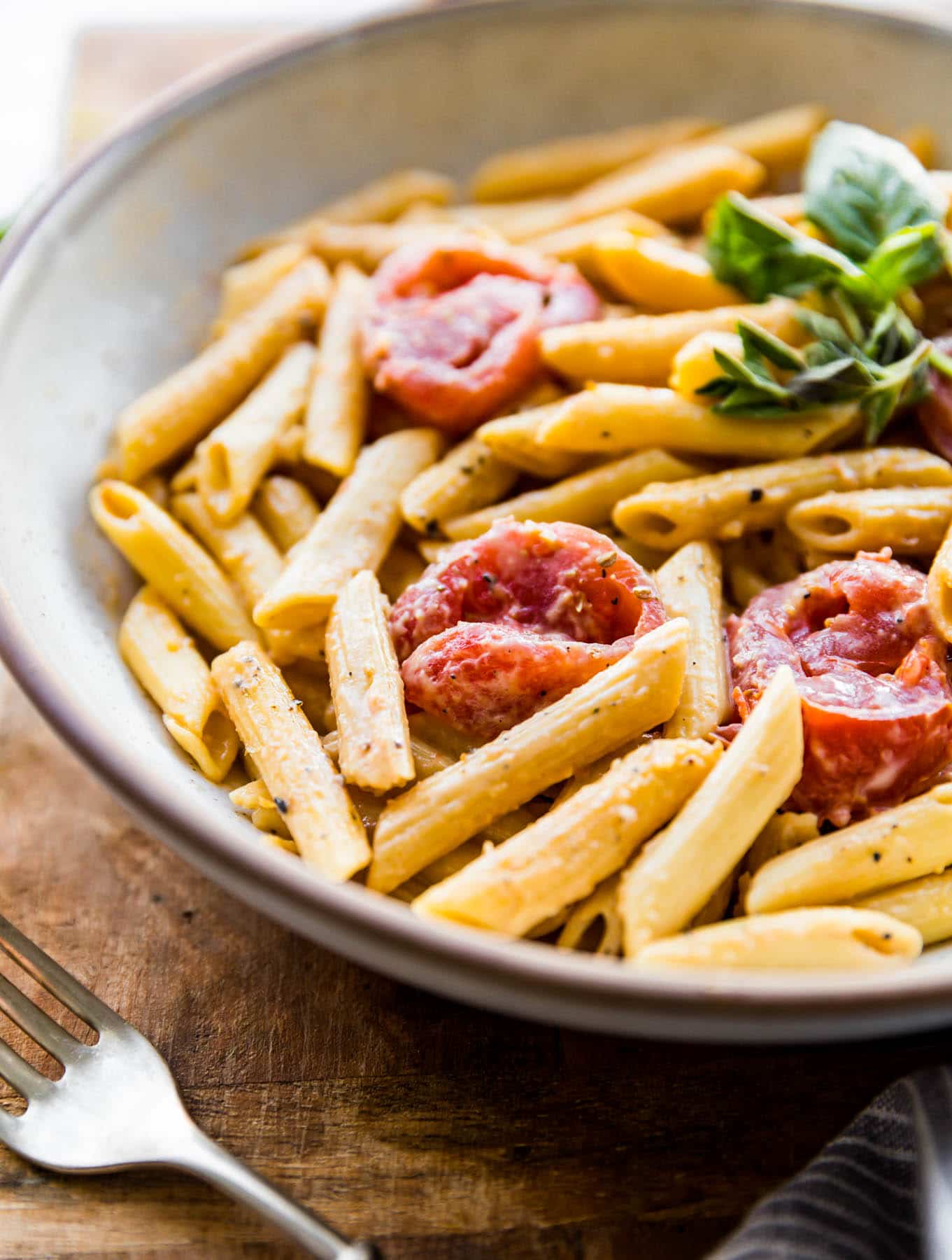 bowl of gluten free penne with creamy dairy free tomato sauce