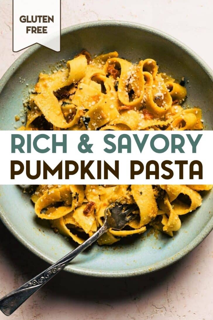 Close-up of fork twirling creamy pumpkin pappardelle pasta with crispy bacon pieces and grated parmesan in a blue ceramic bowl with a text overlay for pinterest.
