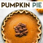 An overhead photo of a Gluten-Free Pumpkin Pie sitting on a marble countertop with a text overlay for pinterest.