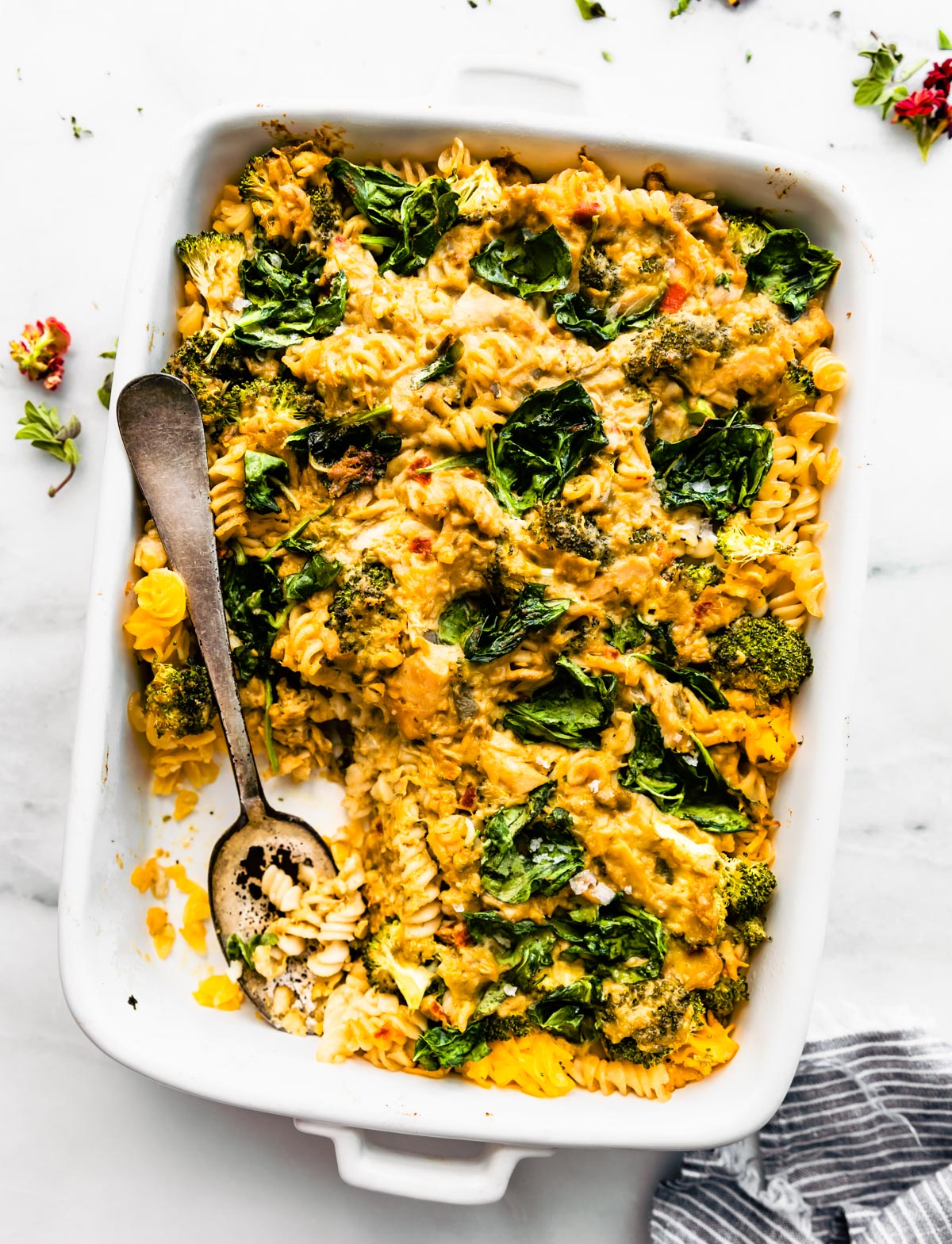Overhead shot of dish full of The Best Tuna Noodle Casserole being scooped out by a spoon.