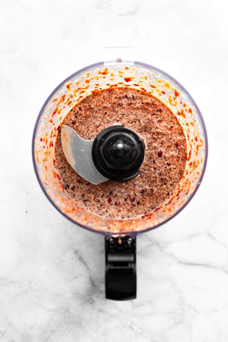 overhead image of a food processor full of homemade cranberry marinade