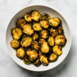 golden and caramelized Air fryer Brussels sprouts in white bowl