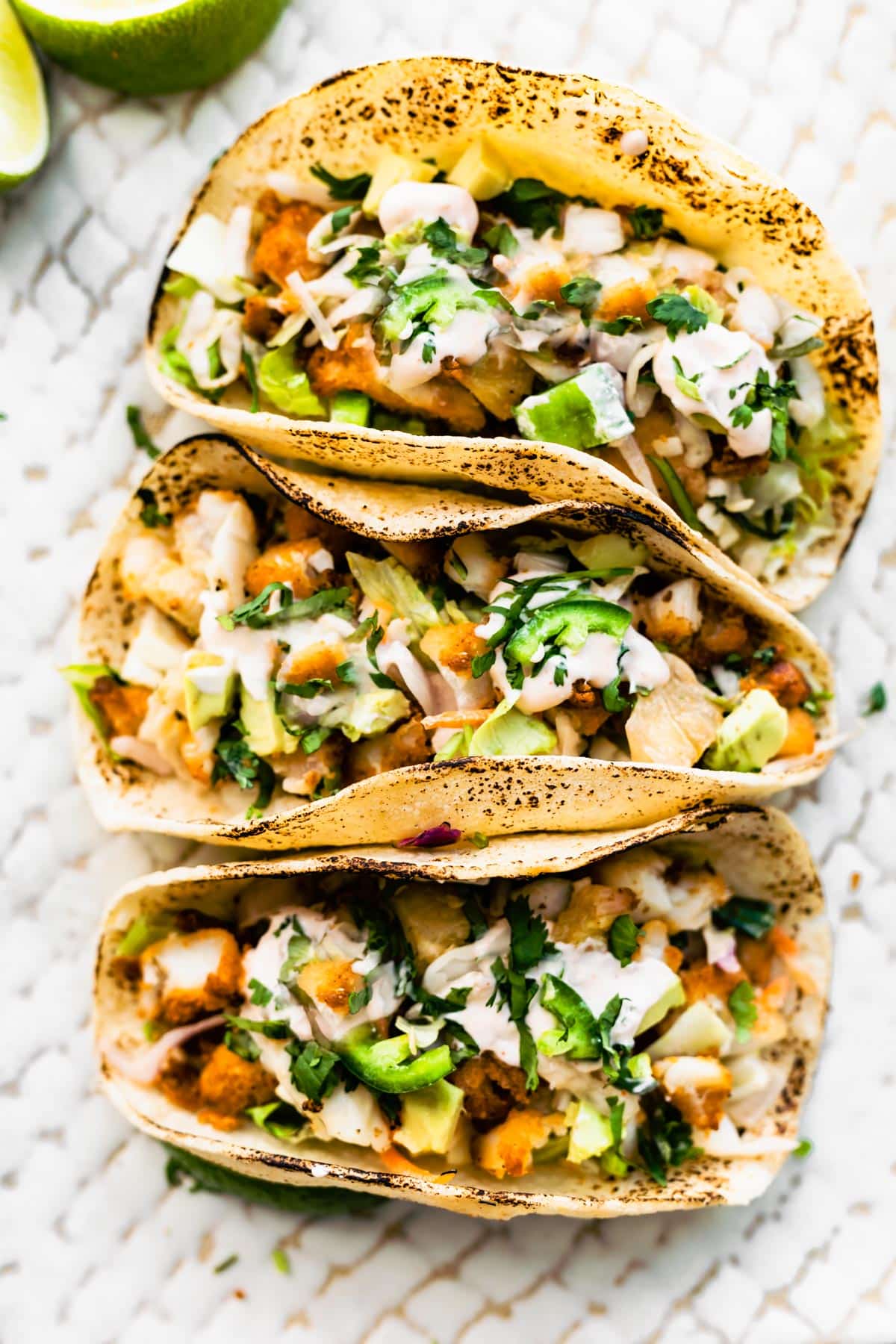 Three gluten-free air fryer fish tacos.