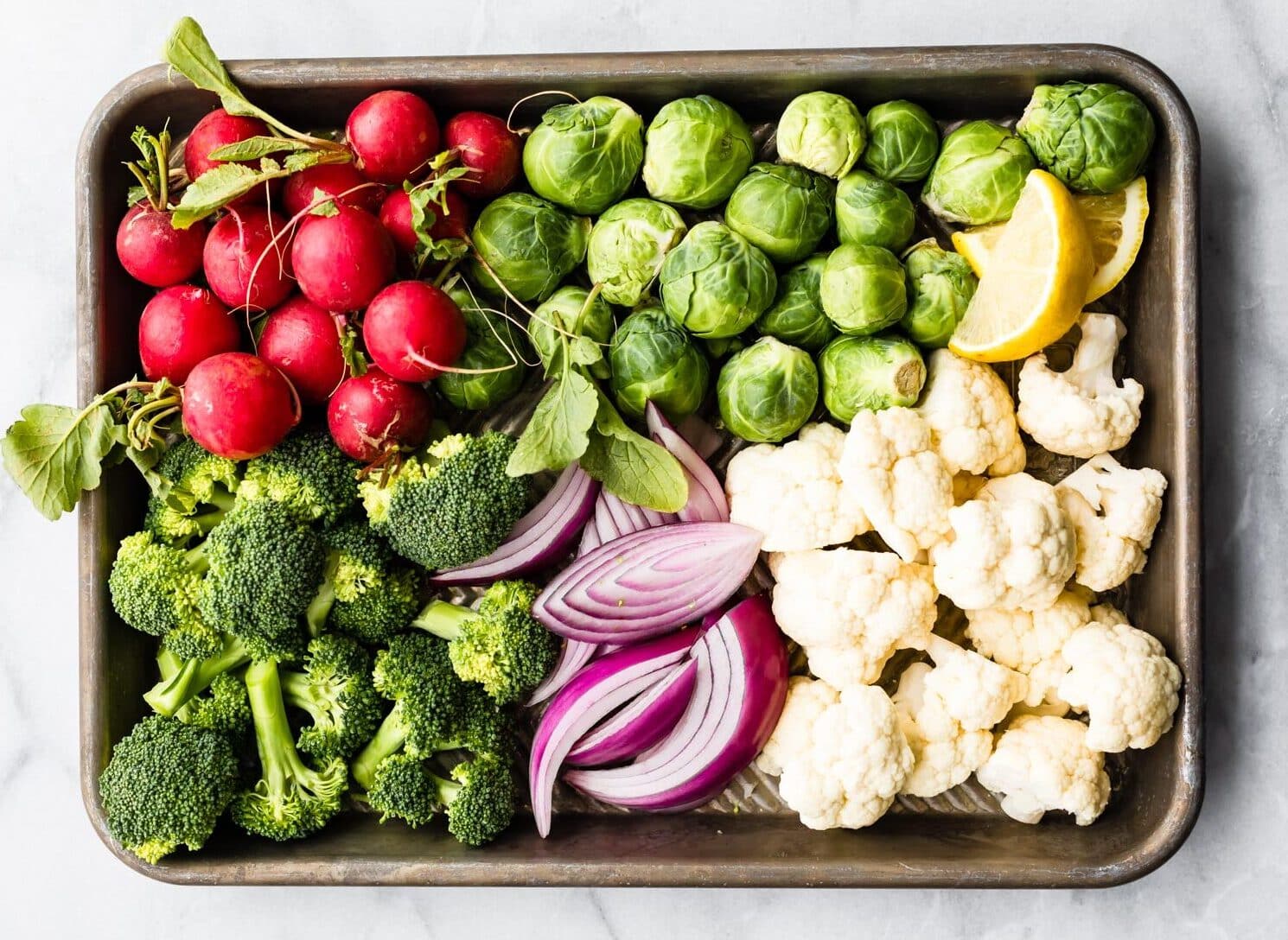 sheet pan of raw vegetables to be cooked in air fryer