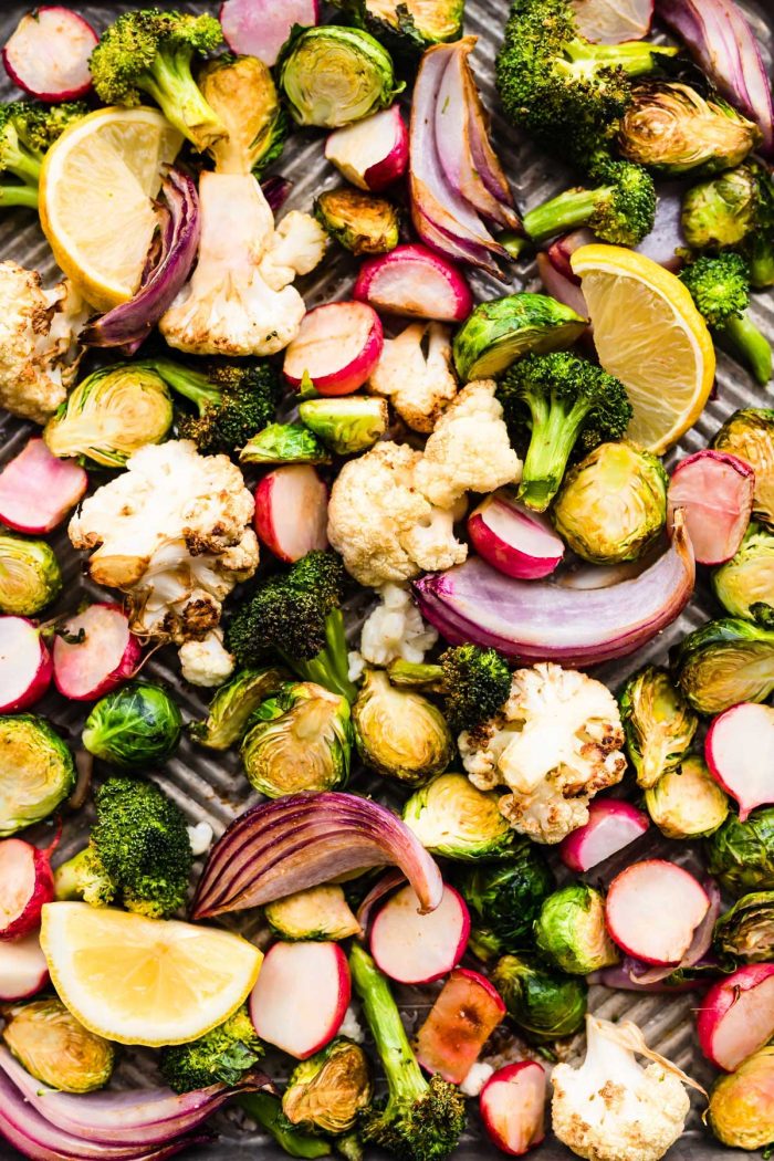 close up image of air fryer veggies (broccoli, cauliflower, radishes, Brussels sprouts and red onion