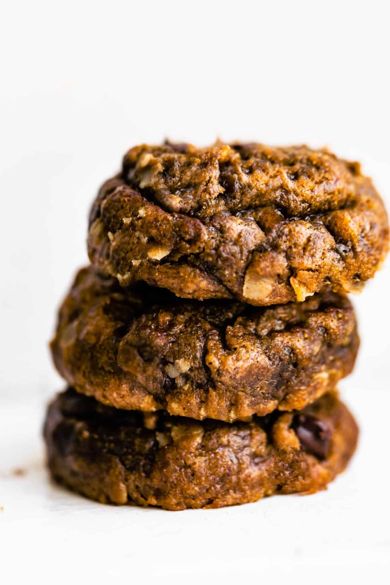 Three fluffy banana breakfast cookies stacked on top of each other.
