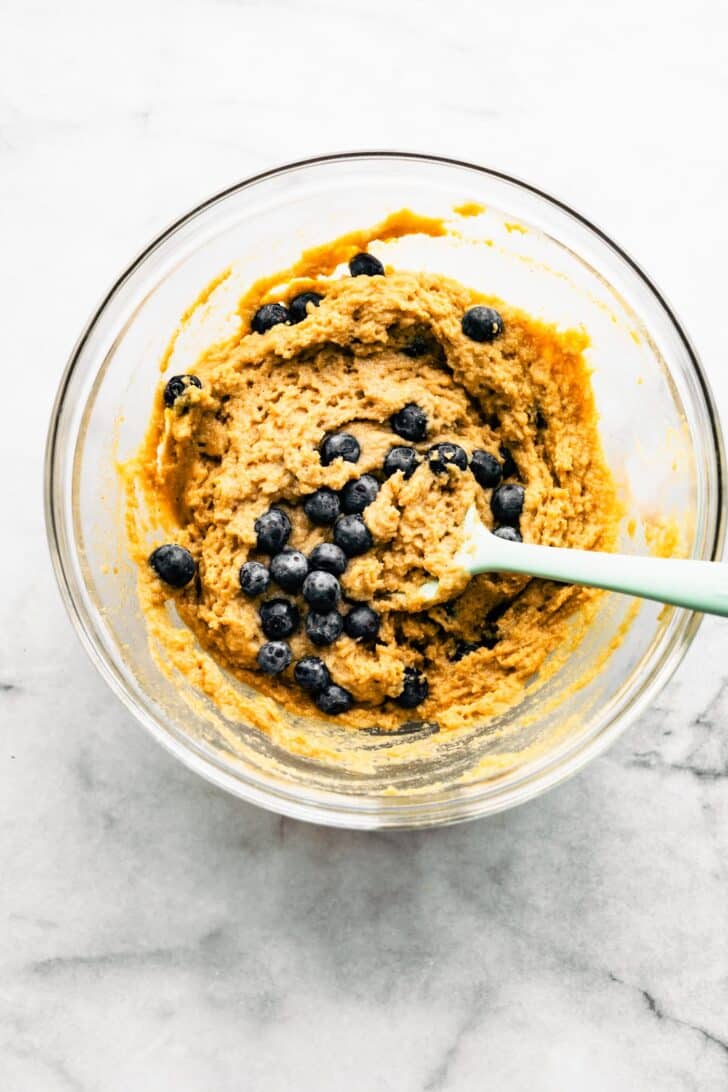 blueberry coffee cake batter in a bowl with a spatula