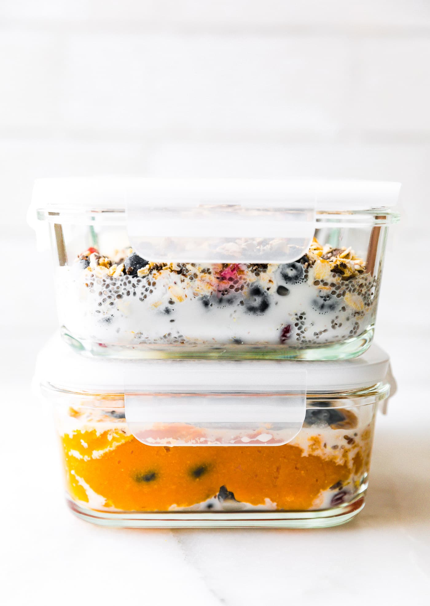 side shot of meal prep container for overnight oatmeal with blueberries