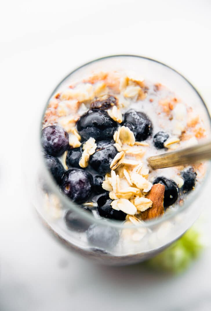 blueberries + superfood overnight oatmeal in a glass - overhead shot