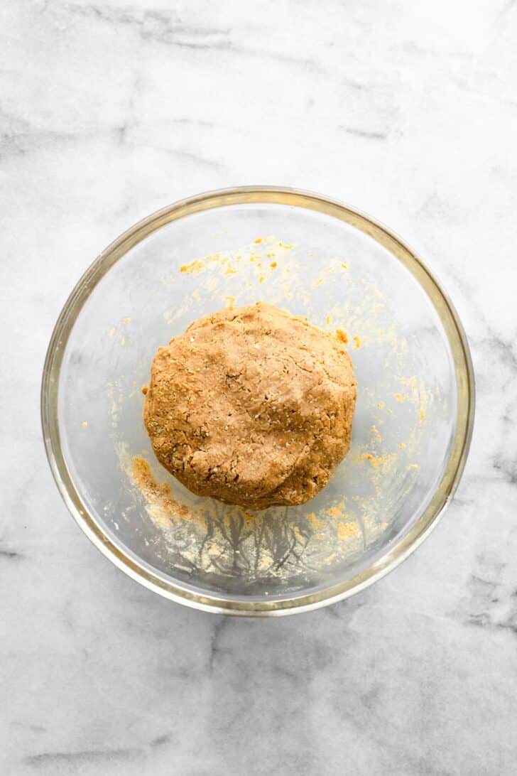 dough ball for protein bites in a clear bowl