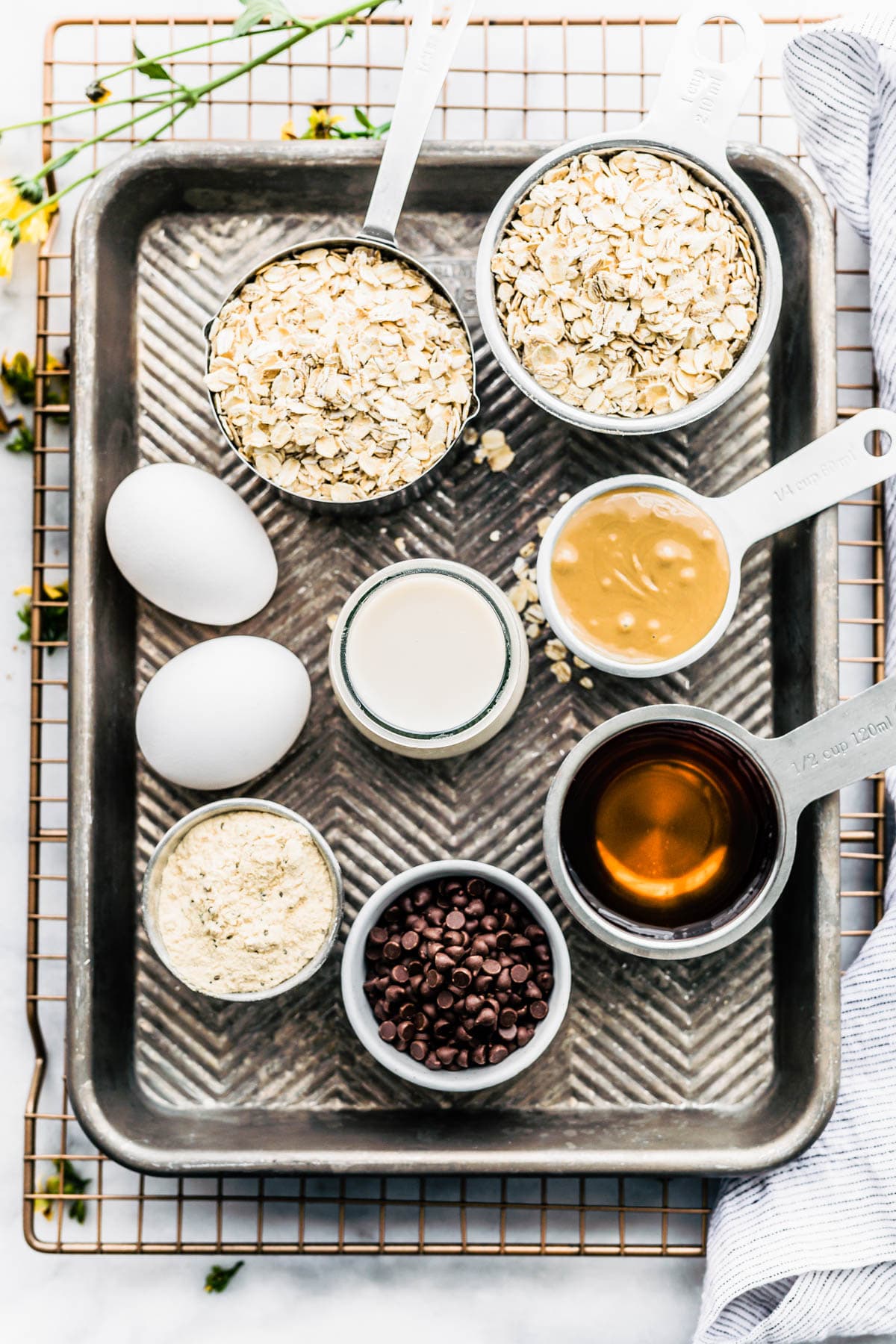 ingredients for flourless chocolate chip protein muffins on a baking sheet