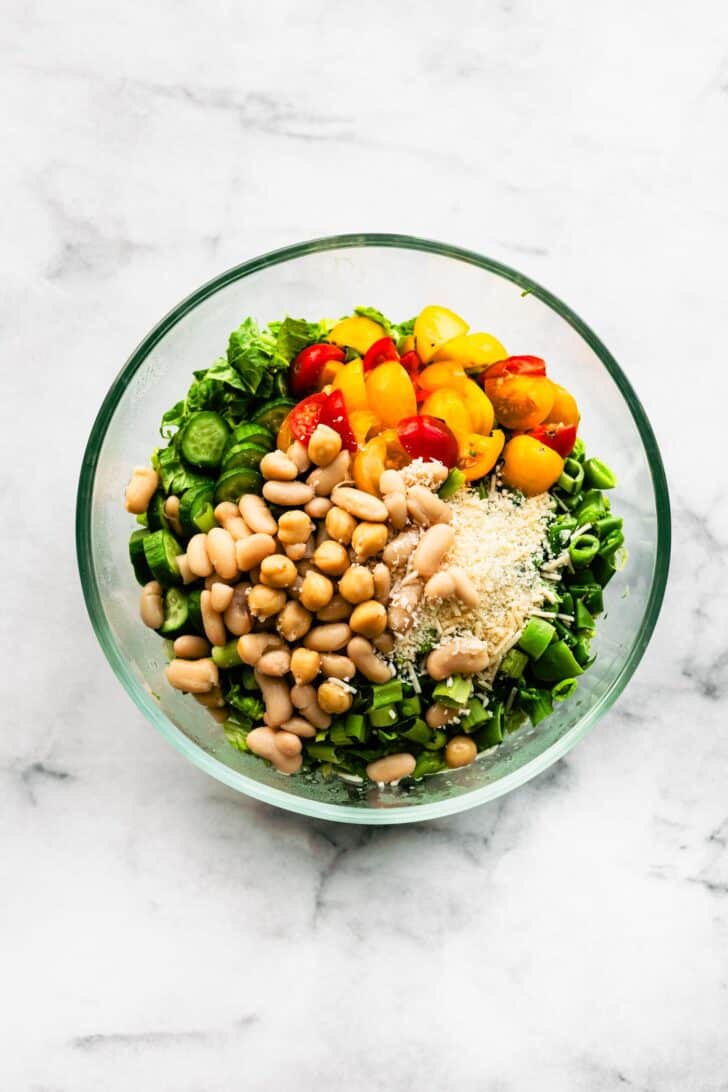 This chopped Romaine salad with white beans is hearty, refreshing, and packed with plant-based protein. Tossed in a tangy vinaigrette, it's perfect as a side or main dish!