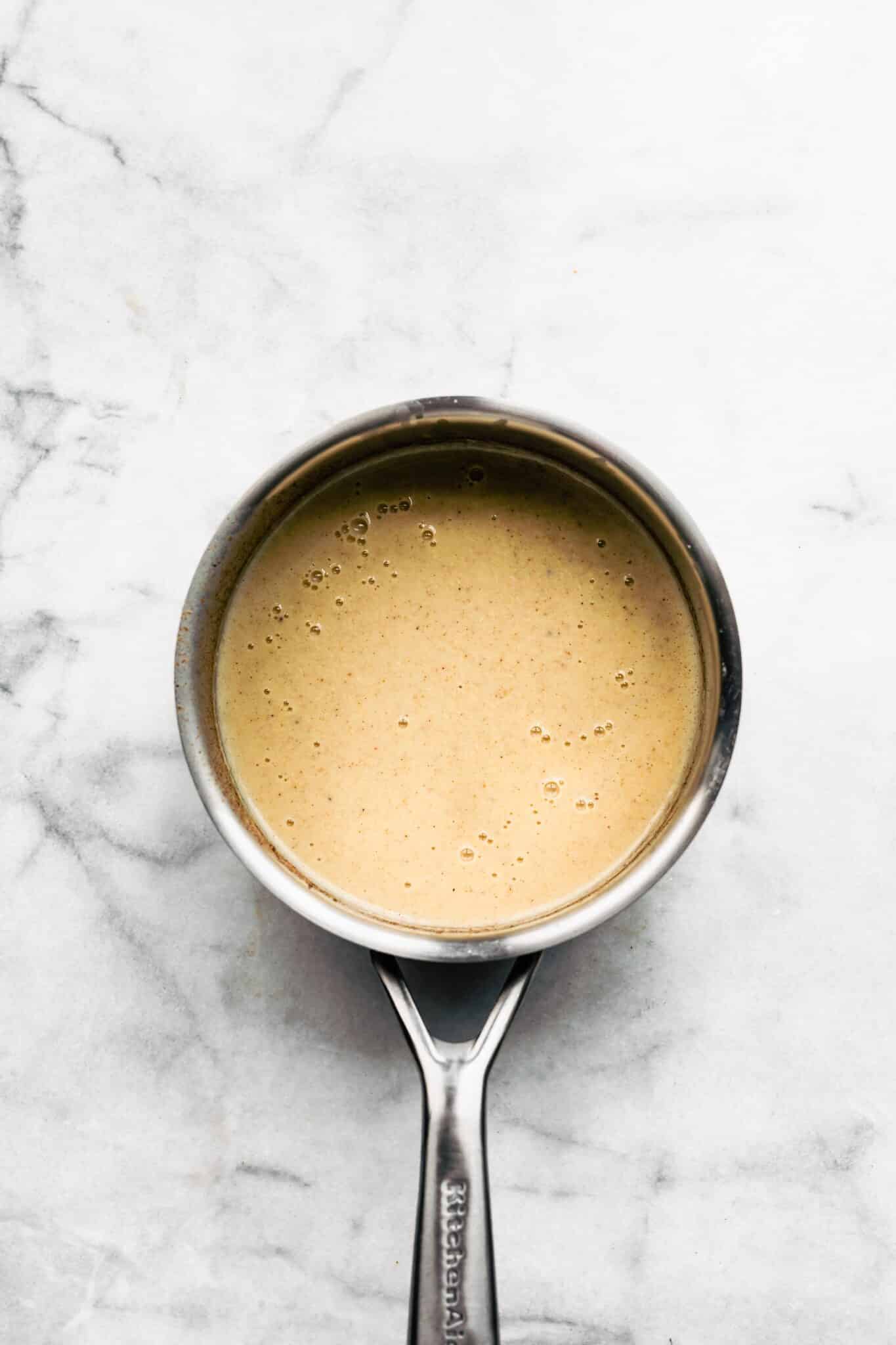 pot of homemade dairy free egg nog.