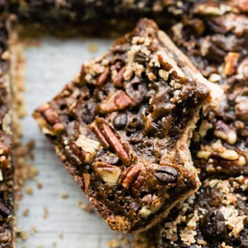 pan of pecan date bar cookies, one with bite removed
