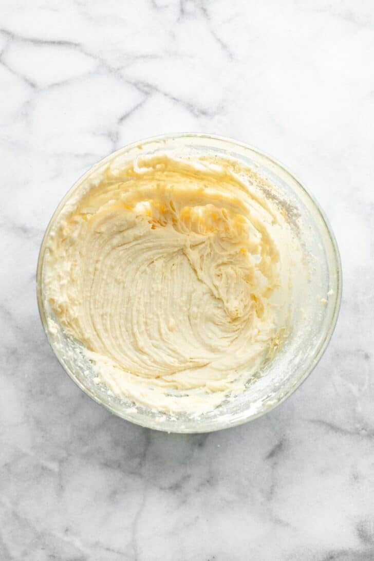 cream cheese frosting batter beaten in a bowl.