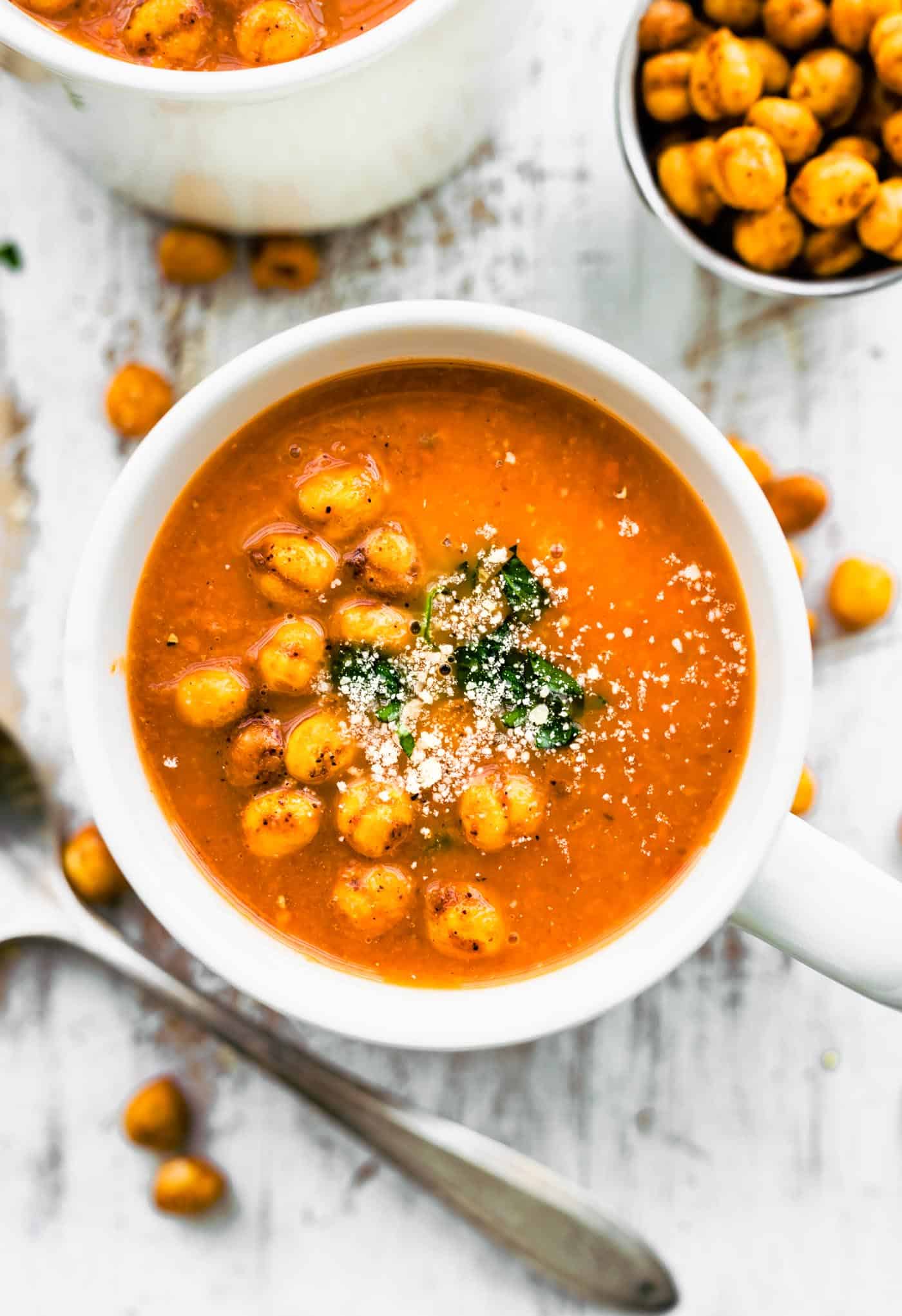 Overhead photo of dairy free carrot soup topped with crispy chickpeas.