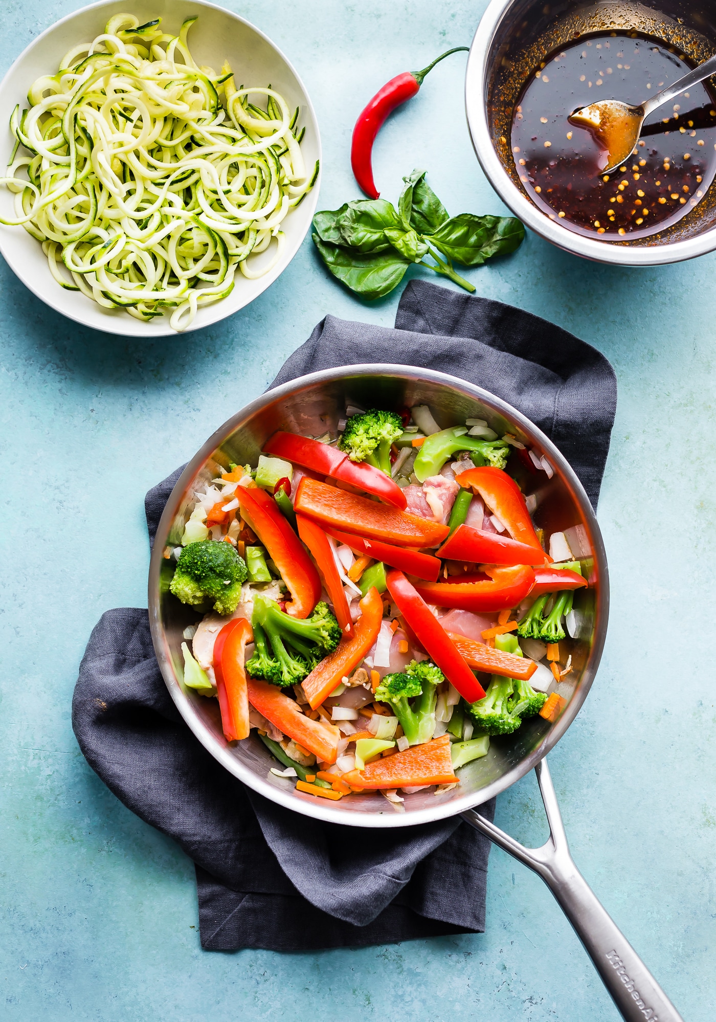 Drunken Chicken Zoodle Casserole takes a spin on the original Pad kee mao Asian stir fry and puts it in casserole form. A paleo zucchini noodle casserole with tons of flavor, Thai spices, and simple healthy ingredients! A delicious, light, high protein, low carb recipe. | CotterCrunch.com